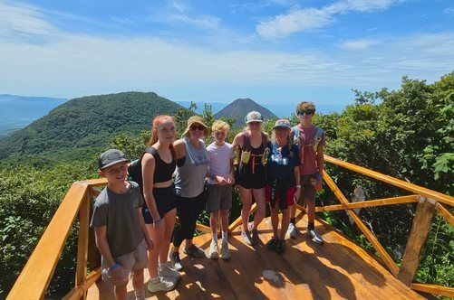 Group of travelers at a volcano viewpoint